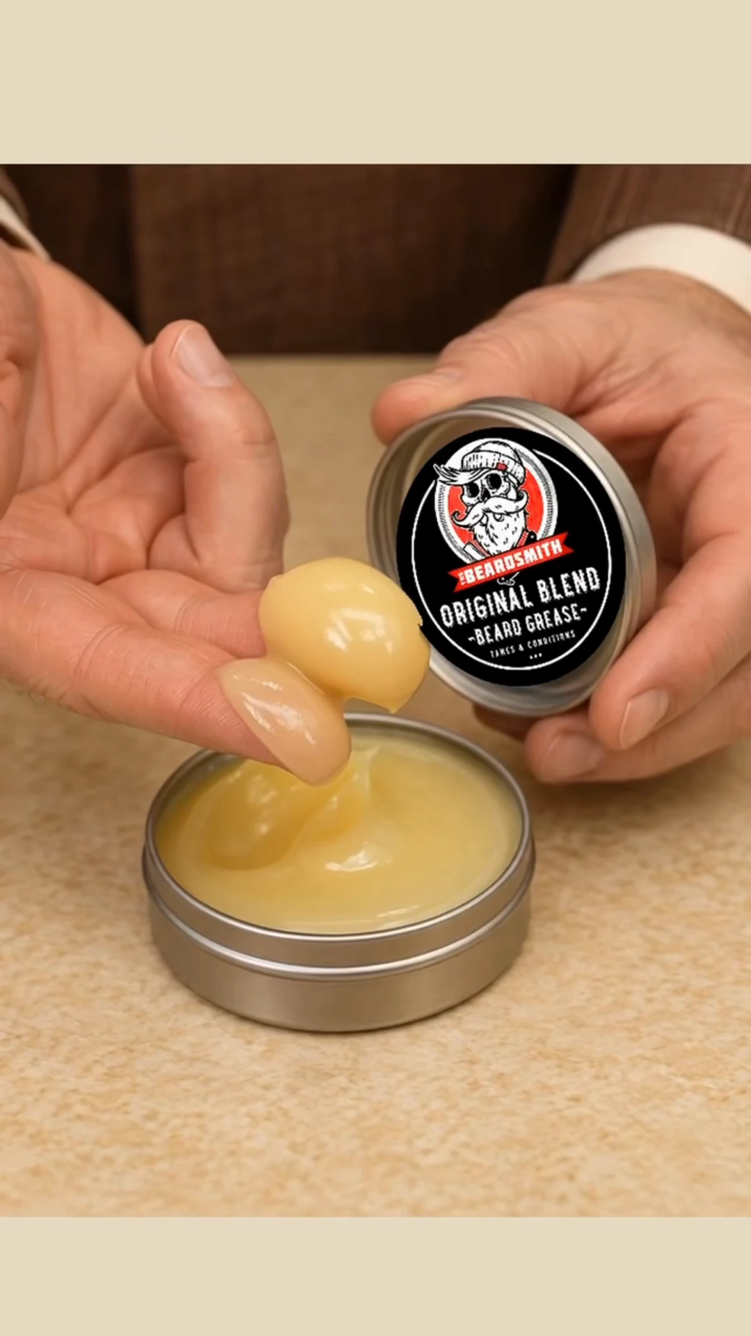 The original Beardsmith Beard Grease tin and its golden grease in The Grease Man film.